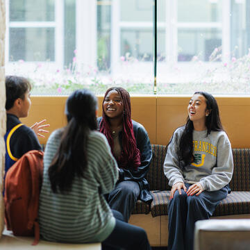 students talking together on campus