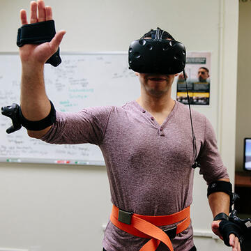 Student in lab wears a virtual reality control unit