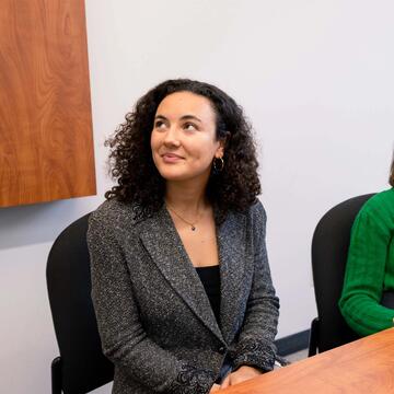 Two USF students actively listening in class