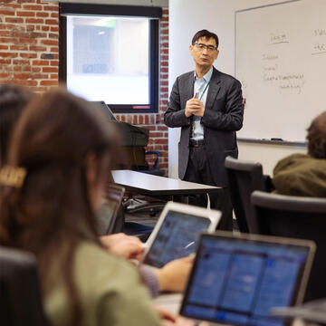 professor teaches class at USF's downtown location