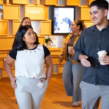 Student listens to a Google employee on a tour.