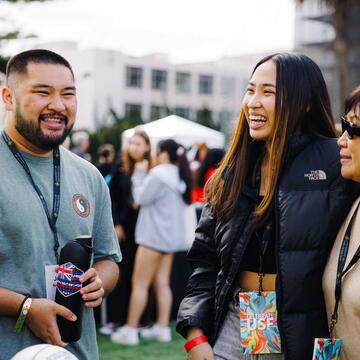 USF alumni smiling and talking
