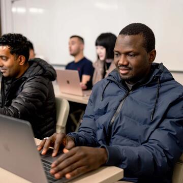 USF students working on their laptops