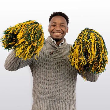 USF staff member waving pom poms