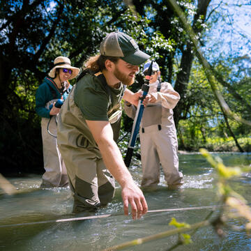 students collect data in the fields for environmental health and hazard study
