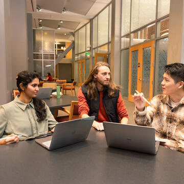 three students studying