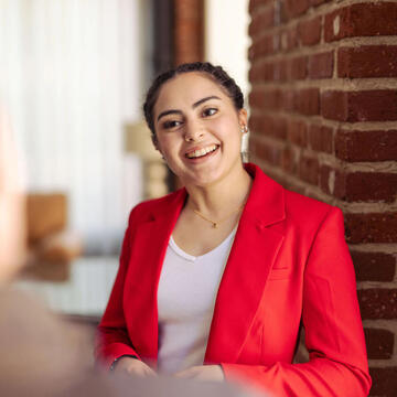 USF student in business attire, smiling