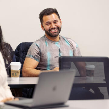 Computer science student smiling.