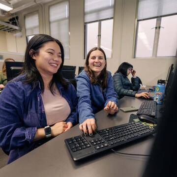 Two students working in a lab