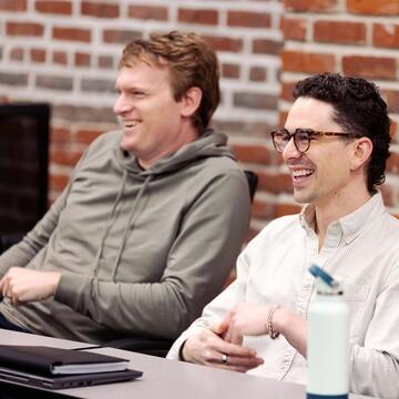 two student laughing in class
