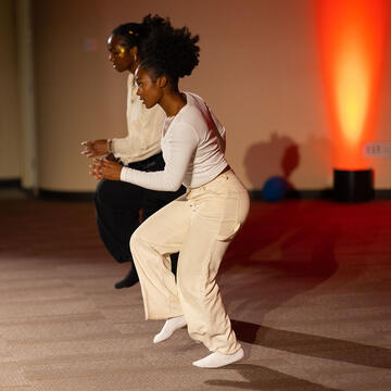 Two students dancing.