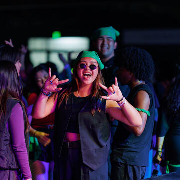 Smiling student at drag show.