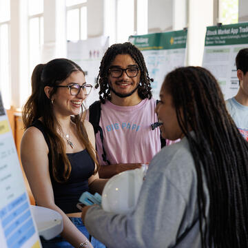Three USF students chatting