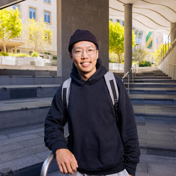 Student posing on lower campus