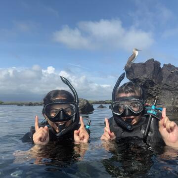 Two students snorkeling in the Galapagos