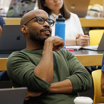 student smiles in class