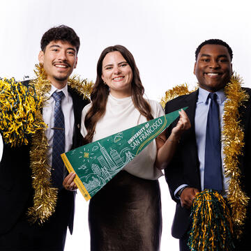 Admission counselors with decorations and pennant