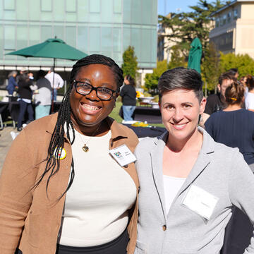 Two USF faculty members smiling