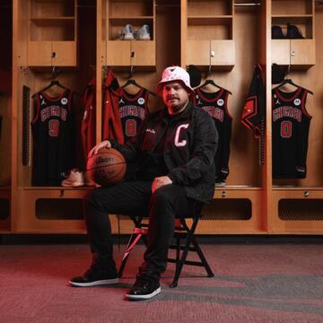 Thomas Sweeney posing in Cubs merch