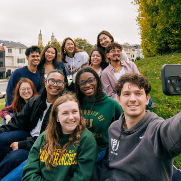 Group of students poses for a selfie.