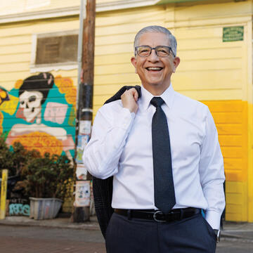 President Aceves poses on a SF street corner