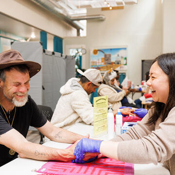 nursing students provides health services to an individual at The Healing Well in the Tenderloin