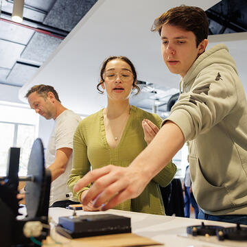 Two students work on a project