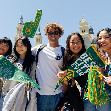 Students wave penants and pom poms celebrating USF