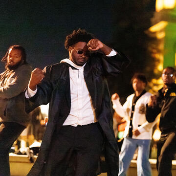 Students performing on campus.