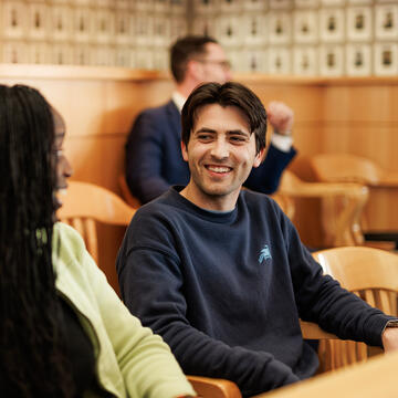 Law student smiling in courtroom