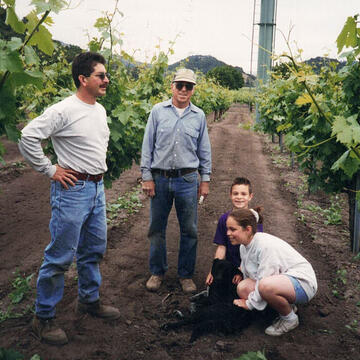 Old photo of the Bazán family playing in Napa’s vineyards