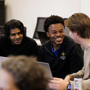 mba students laugh together in class