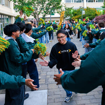 Students greeted by a lineup of orientation volunteers