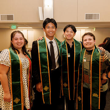 usf students wearing MAGIS sashes during event