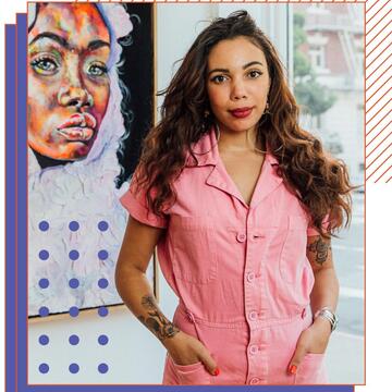 Photo of Taylor Smalls in a gallery of her artwork