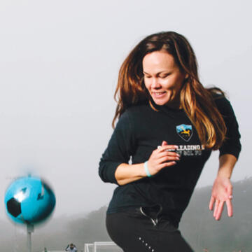 Brianna Russell MA &#039;12 juggles a soccer ball with her feet