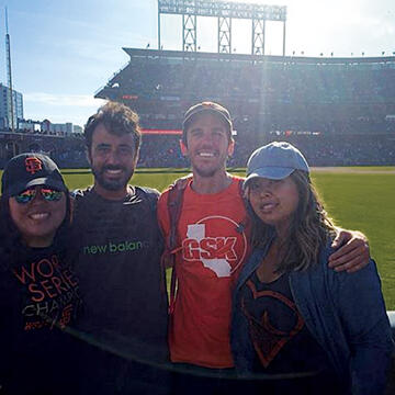 USF baseball fans with AT&T Park outfield in the background