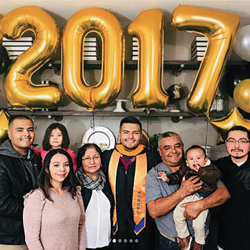 Abelardo Mora '17 celebrating graduation with his family