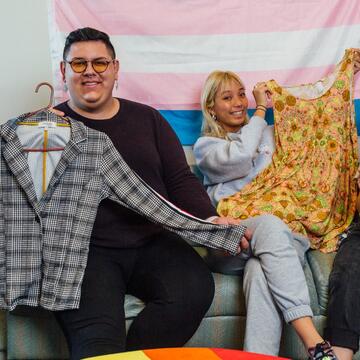 Students at the gender affirming clothing closet, sign says there are no limits to your expression