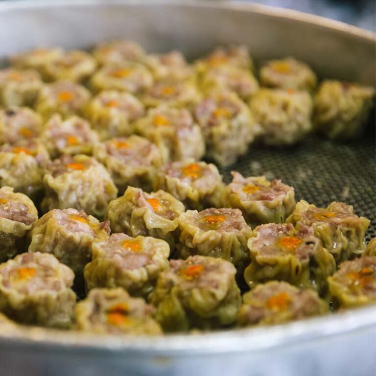 a batch of dim sum dumplings ready to serve