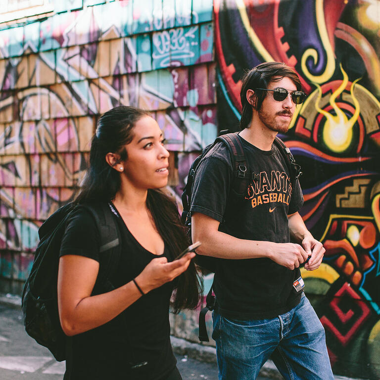 students walking along clarion alley in the mission
