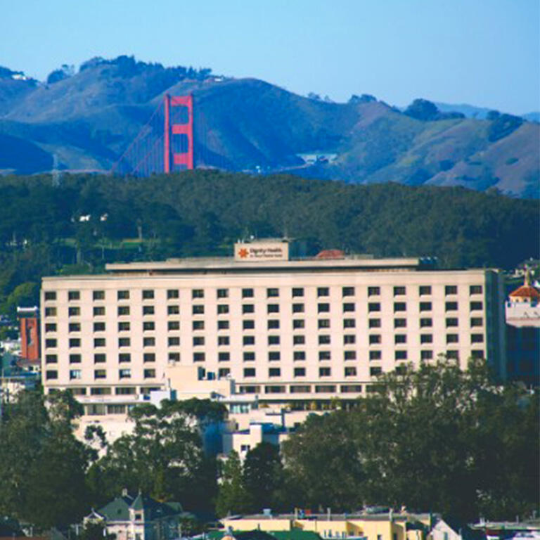 Dignity Health St Mary's Hospital with Golden Gate Bridge behind