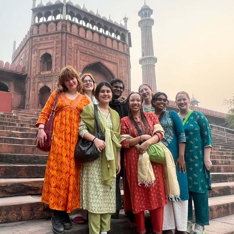 Group of students stands on stairs in India