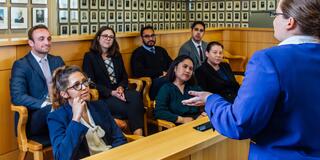 Student presents to a jury in moot court.