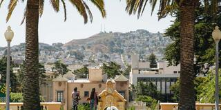 View of city between the palms of Lone Mountain.