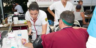 Two nursing students with a patient