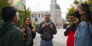 Students conversing on campus.