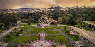 SkyStar ferris wheel in Golden Gate Park, with USF visible behind it