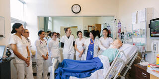USF nursing students standing in a lab