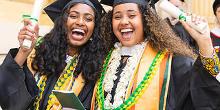 Two students in caps and gowns